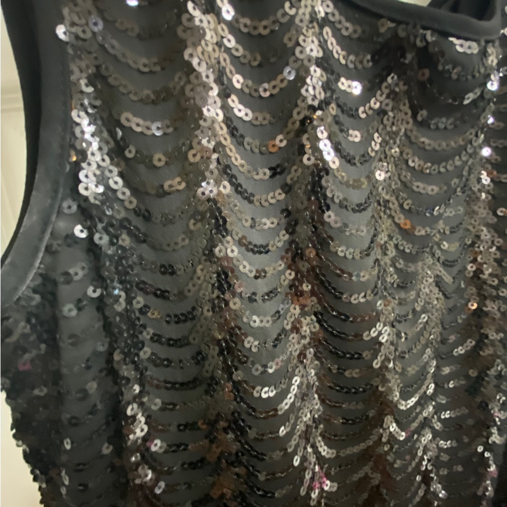 Black party dress. Shiny metallic finish. Short length. Size 12. - Picture 3 of 4